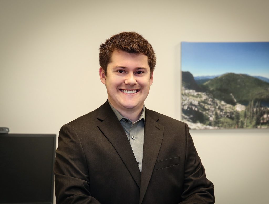 Smiling man in a suit in an office